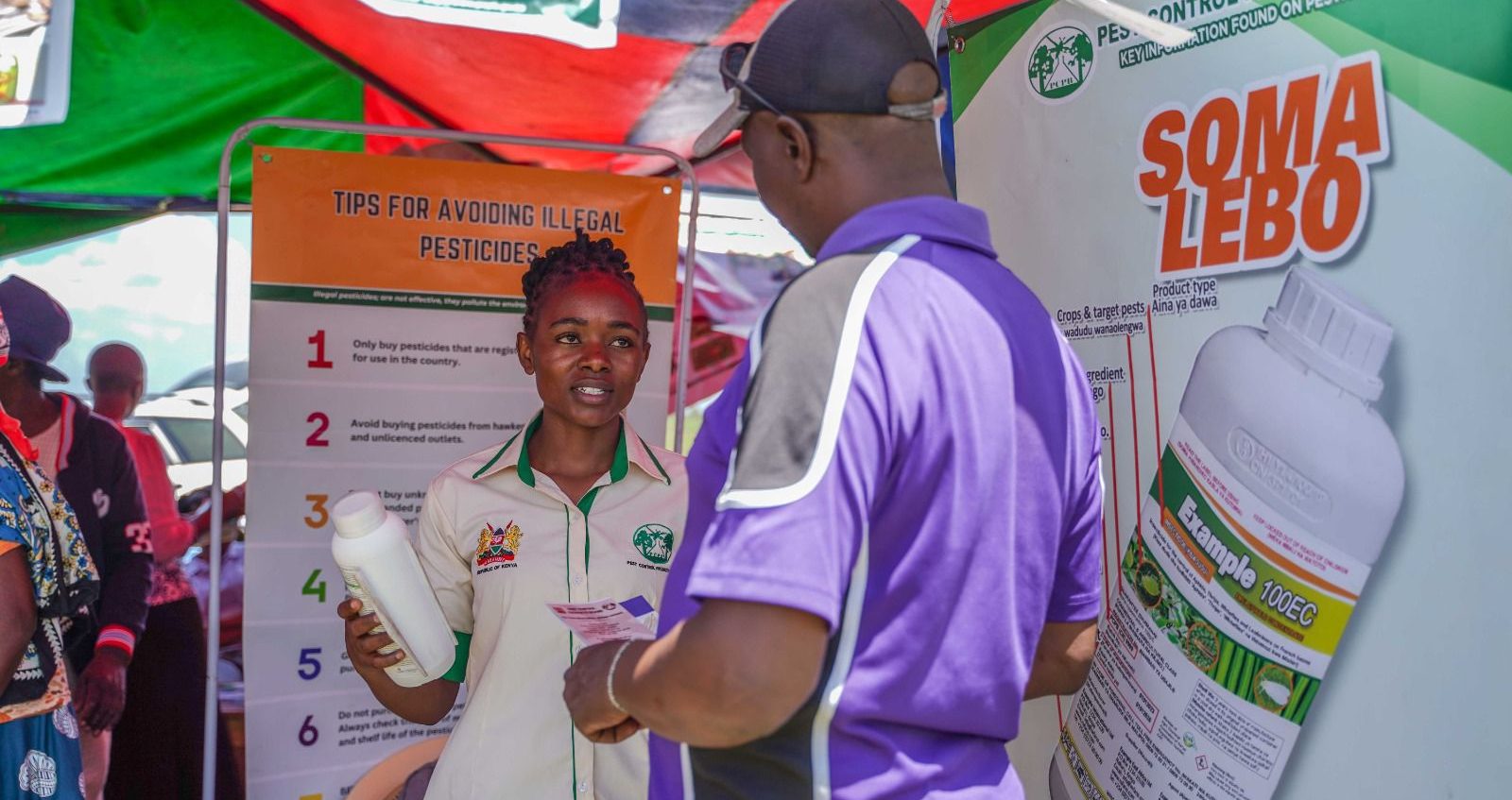PCPB officer educating a farmer on the importance of reading label instructions