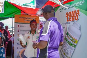 PCPB officer educating a farmer on the importance of reading label instructions